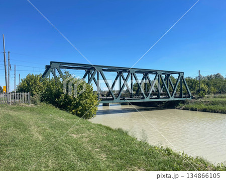 Steel train bridge in a rural area, Ferrara, Italy 134866105