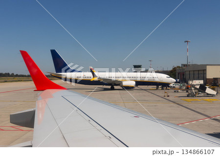 Commercial airplane before takeoff Bologna airport, Italy 134866107