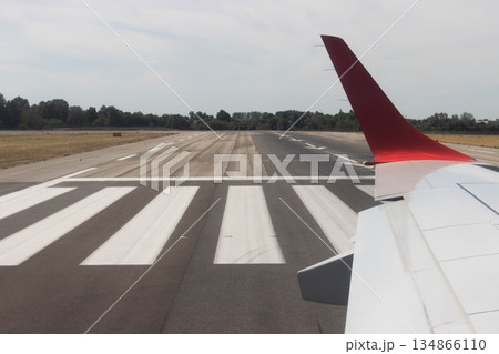 Commercial airplane before takeoff Bologna airport, Italy 134866110