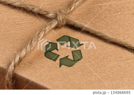Close Up of Biodegradable Packaging with Recycling Symbol for Sustainable Fashion Products Close Up of Biodegradable Packaging with Recycling Symbol for Sustainable Fashion Products 134866695