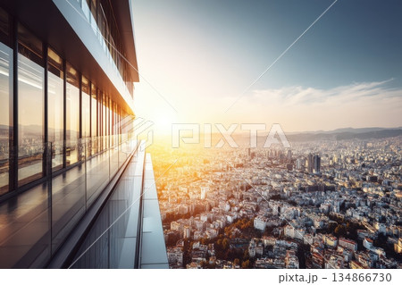 Modern Glass Office Building Reflecting City Skyline at Sunset in Urban Environment Modern Glass Office Building Reflecting City Skyline at Sunset in Urban Environment 134866730