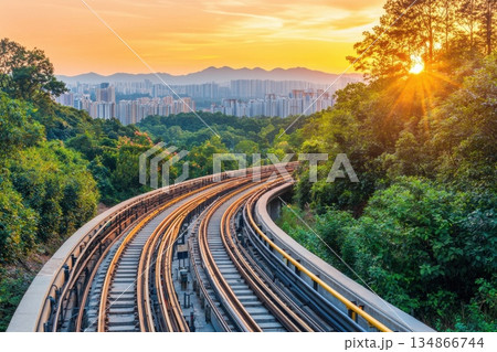 Futuristic Cargo Rail System Gliding Through Scenic Landscape at Sunset 134866744