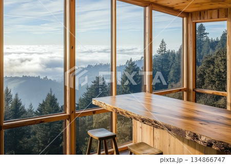 Minimalist Modern Wooden Counter with Stunning Hilltop View Over Clouds and Trees 134866747