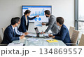 Business team analyzing data in modern office meeting room 134869557