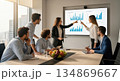 Business team analyzing data in modern office meeting room 134869667