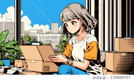 引っ越しの荷造り・荷解きをしている若い女性