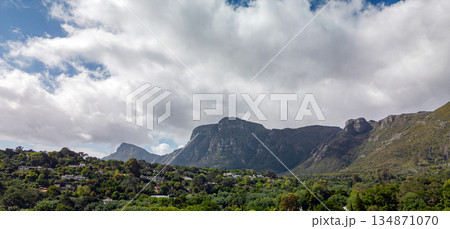 Panoramic view of mountain range, with green trees and residential area Panoramic view of mountain range, with green trees and residential area 134871070