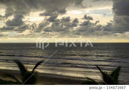 Stormy looking seascape with heavy clouds, muted light, and a darkened ocean surface, Kuala Penyu, Sabah, Malaysia. Stormy looking seascape with heavy clouds, muted light, and a darkened ocean surface, Kuala Penyu, Sabah, Malaysia. 134871667