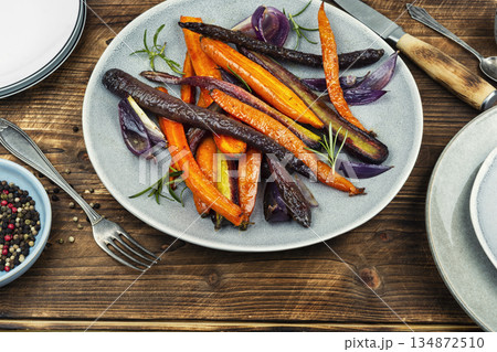 Vegetarian healthy food, baked carrots. 134872510