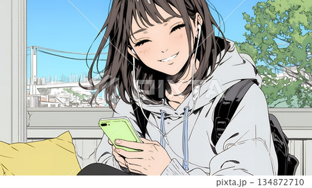 楽しそうにスマホ画面を眺めている若い女性