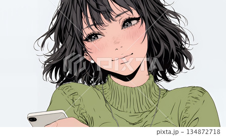 楽しそうにスマホ画面を眺めている若い女性