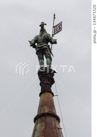 The castle spire with a statue on top 134873320