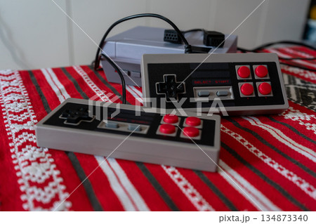 Retro games console on a wooden table 134873340