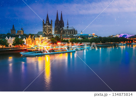 Cologne, Germany. Great St. Martin Church And Dom In Cologne At Evening With Reflection In River Rhine. Evening Blue Hour 134873814