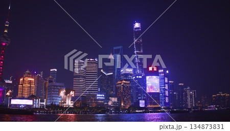 Nighttime of Shanghai Skyline Showing Brilliant Colors on Water Reflections Nighttime of Shanghai Skyline Showing Brilliant Colors on Water Reflections 134873831