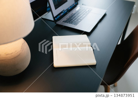 laptop on desk in office 134873951