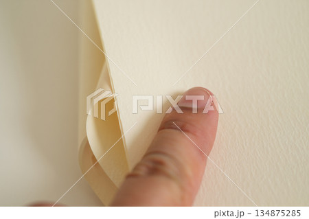 hand holding book on wood 134875285