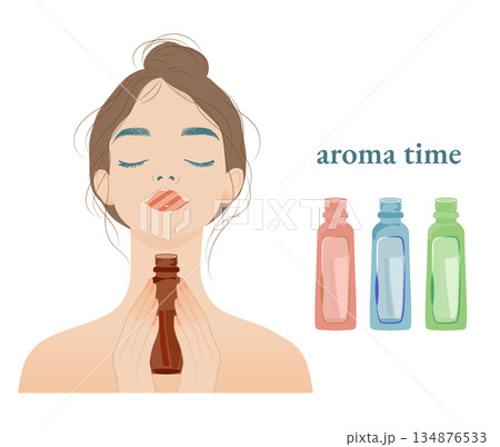 アロマの香りを嗅いている女性とカラフルなアロマの瓶 アロマの香りを嗅いている女性とカラフルなアロマの瓶 134876533