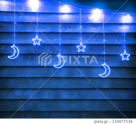 Bright glowing Xmas decoration. Stars and moon Bright glowing Xmas decoration. Stars and moon 134877536