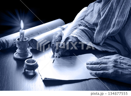Male hand witn big quill Male hand witn big quill 134877555