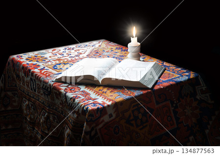 Big old bible and candle Big old bible and candle 134877563