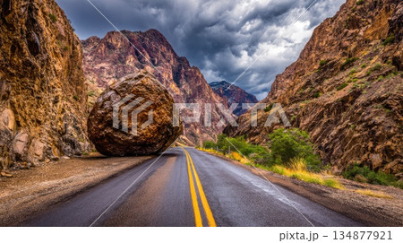 Massive Boulder Blocking Mountain Road After Landslide and Storm 134877921