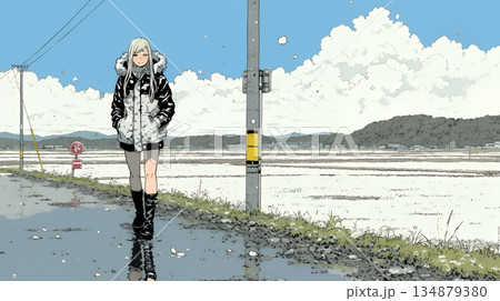 雪解けでぬかるんだ道を歩く若い女性