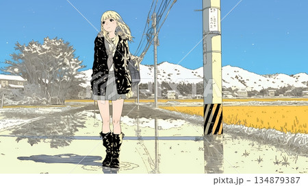 雪解けでぬかるんだ道を歩く若い女性