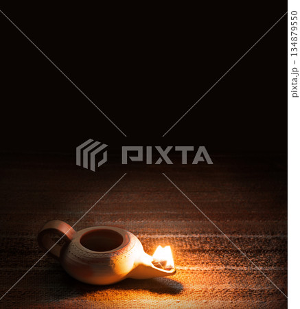 Ancient lamp shines in the dark 134879550