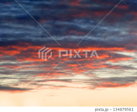 Bright clouds in the evening sky 134879561