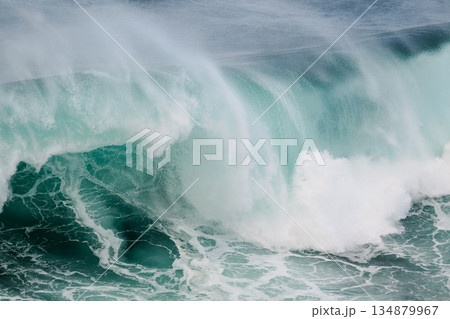 Majestic turquoise wave crashing over reef, powerful ocean surge, dramatic seascape 134879967