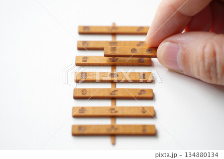 hand hold wood alphabet letter block stacking on white 134880134