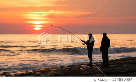 Sunset silhouette of men casting fishing line near ocean 134880484