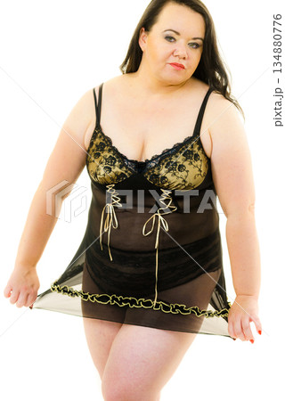 Plus size woman in lingerie tunic 134880776