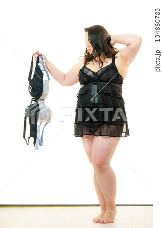 Plus size woman fitting bras Plus size woman fitting bras 134880783
