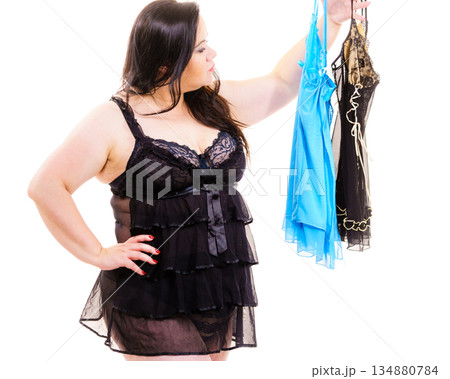 Plus size woman fitting satin nightwear Plus size woman fitting satin nightwear 134880784