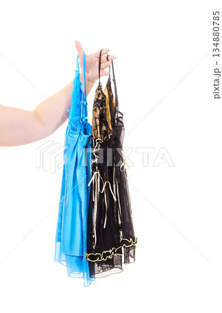 Hand holding satin nightwear Hand holding satin nightwear 134880785