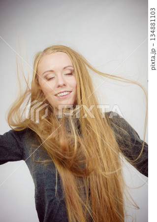 Girl with blowing long hair Girl with blowing long hair 134881103