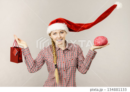 Christmas woman holding shopping bag and brain 134881133