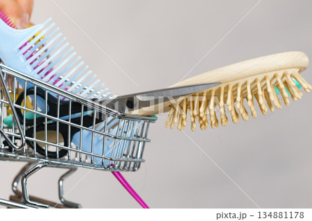 Girl with hair accessories in shopping cart Girl with hair accessories in shopping cart 134881178
