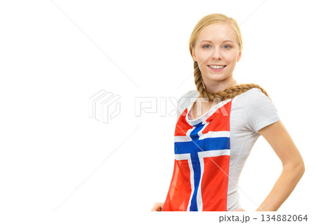 Young woman holding norwegian flag Young woman holding norwegian flag 134882064