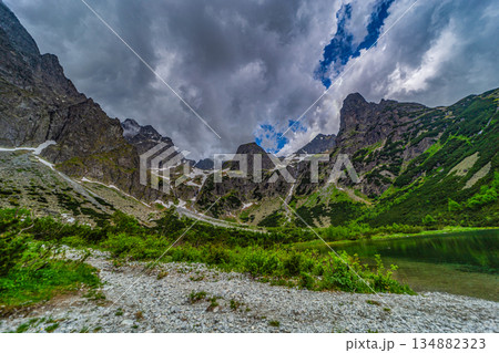 Dark storm clouds over alpine lake Zelene pleso in High Tatras 134882323