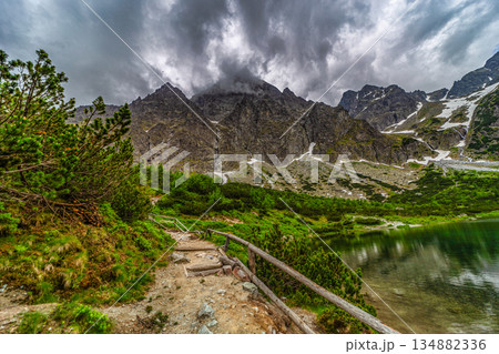 Dark storm clouds over alpine lake Zelene pleso in High Tatras 134882336