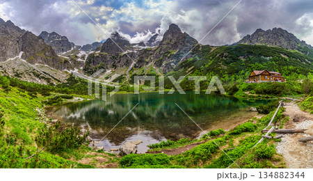 Dark storm clouds over alpine lake Zelene pleso in High Tatras Dark storm clouds over alpine lake Zelene pleso in High Tatras 134882344
