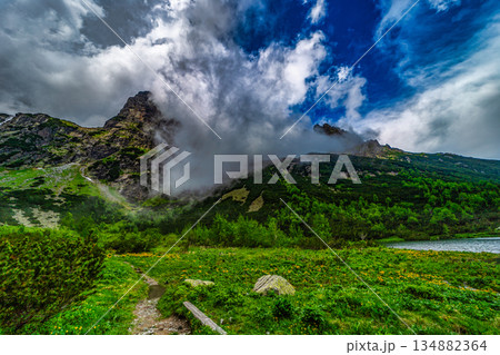 Mist and clouds swirling around Jastrabia veza peak in High Tatras 134882364