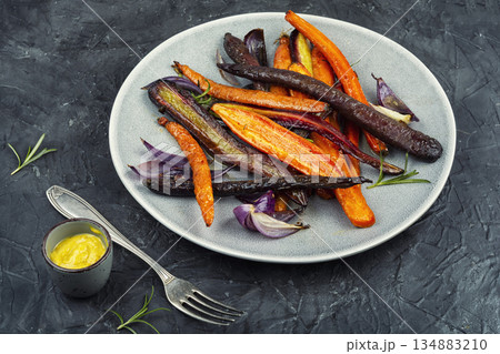 Healthy meal, seasoned roasted carrots. 134883210