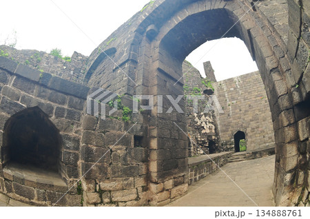 Classic arched entrance at Daulatabad Fort is an ancient fort located in Maharashtra, India. Originally named Deogiri, it is a fort built from natural rocks and is very strong. Classic arched entrance at Daulatabad Fort is an ancient fort located in Maharashtra, India. Originally named Deogiri, it is a fort built from natural rocks and is very strong. 134888761