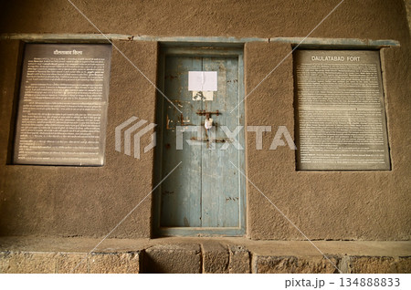 Wooden classic door at Daulatabad Fort is an ancient fort located in Maharashtra, India. Originally named Deogiri, it is a fort built from natural rocks and is very strong. Wooden classic door at Daulatabad Fort is an ancient fort located in Maharashtra, India. Originally named Deogiri, it is a fort built from natural rocks and is very strong. 134888833