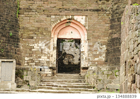 Classic arched entrance at Daulatabad Fort is an ancient fort located in Maharashtra, India. Originally named Deogiri, it is a fort built from natural rocks and is very strong. Classic arched entrance at Daulatabad Fort is an ancient fort located in Maharashtra, India. Originally named Deogiri, it is a fort built from natural rocks and is very strong. 134888839