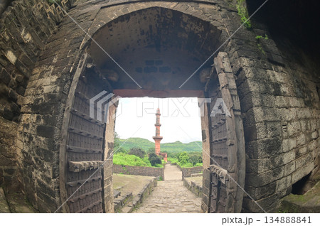 Classic arched entrance at Daulatabad Fort see Chand Minar (Tower of the moon ) is an ancient fort. it is a fort built from natural rocks and is very strong. Classic arched entrance at Daulatabad Fort see Chand Minar (Tower of the moon ) is an ancient fort. it is a fort built from natural rocks and is very strong. 134888841